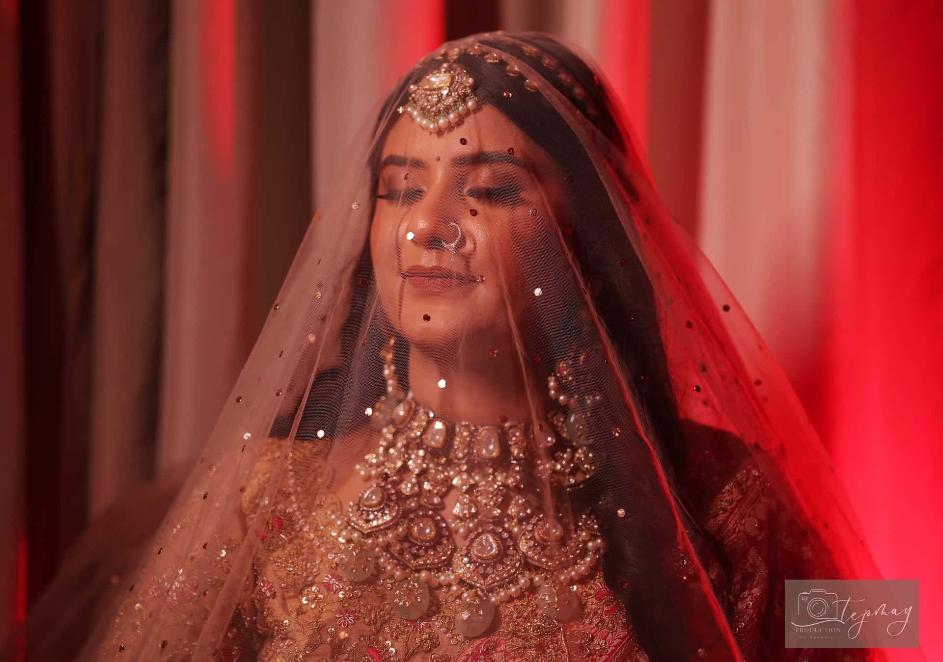 Bride portrait with red veil