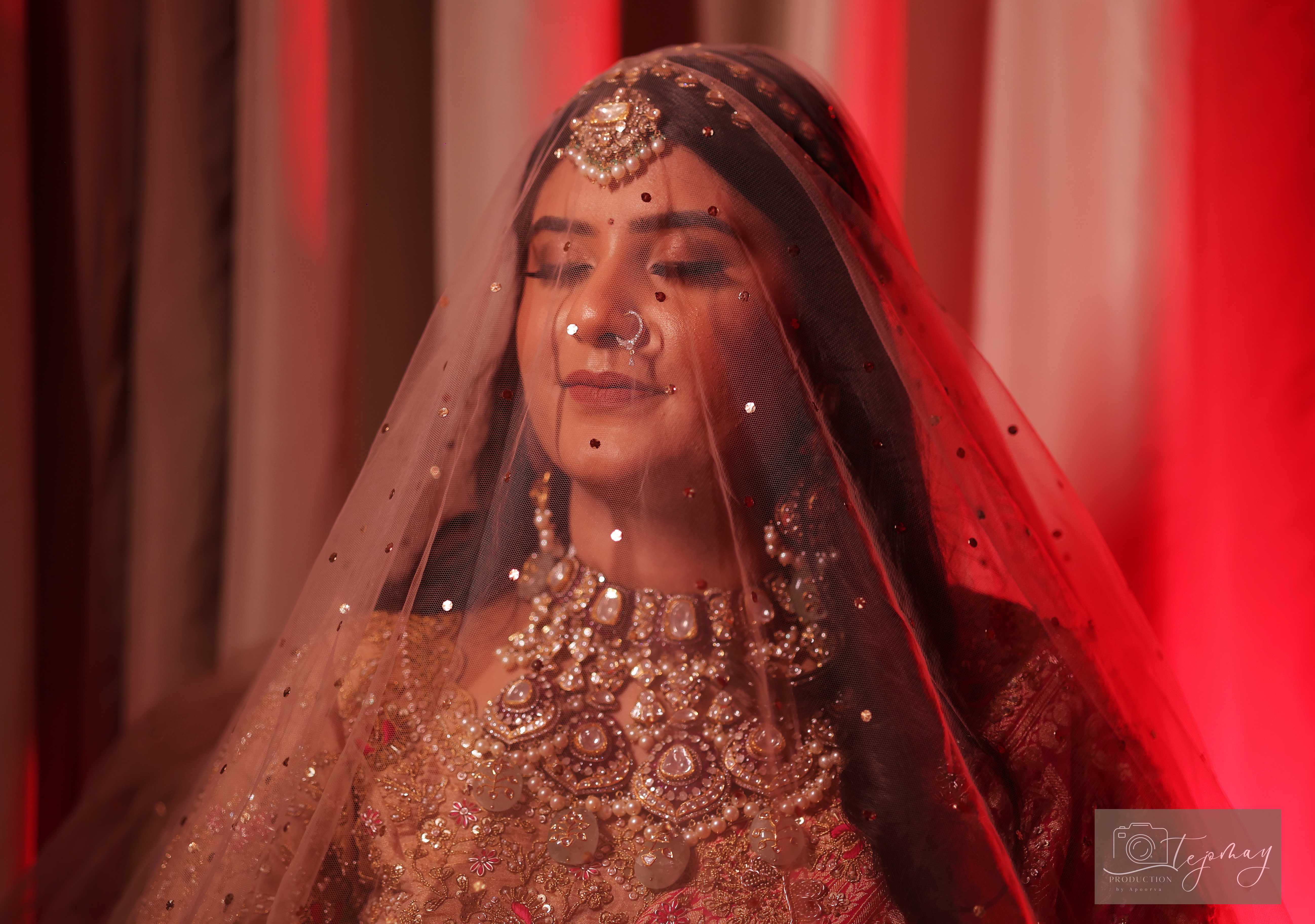 Bride portrait with red veil
